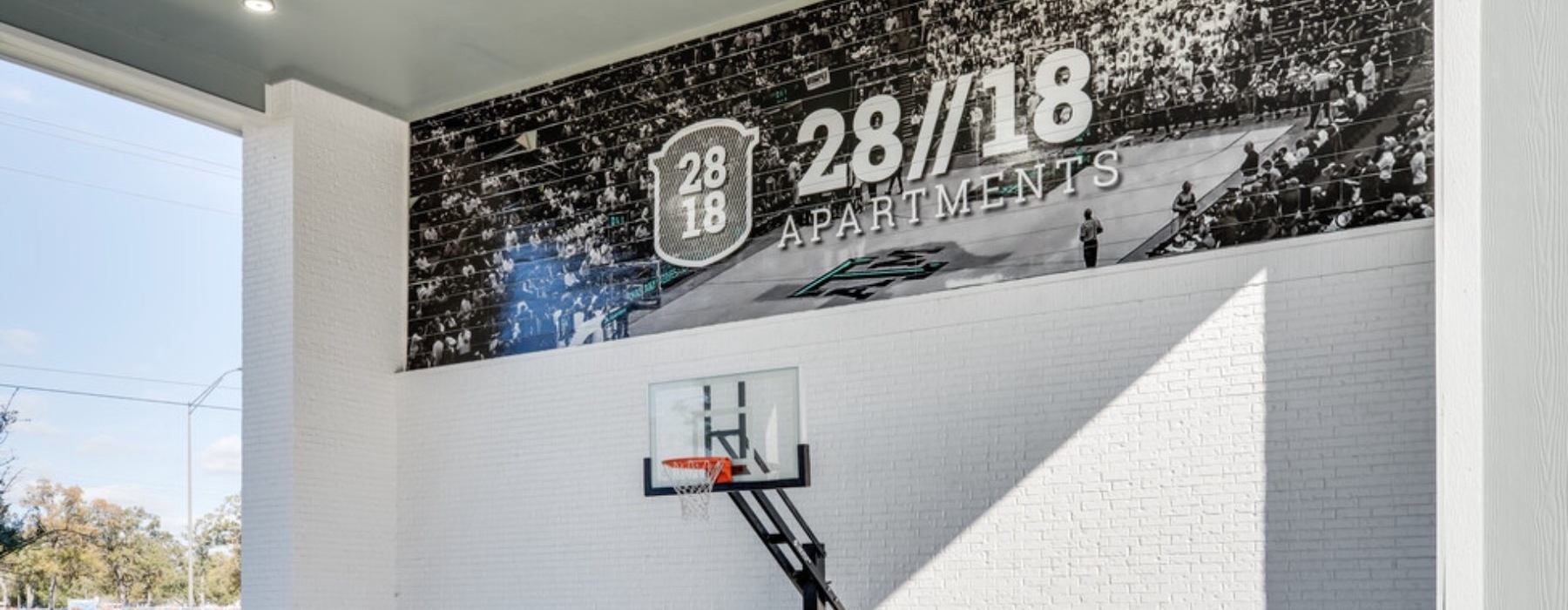 a basketball goal in front of a building